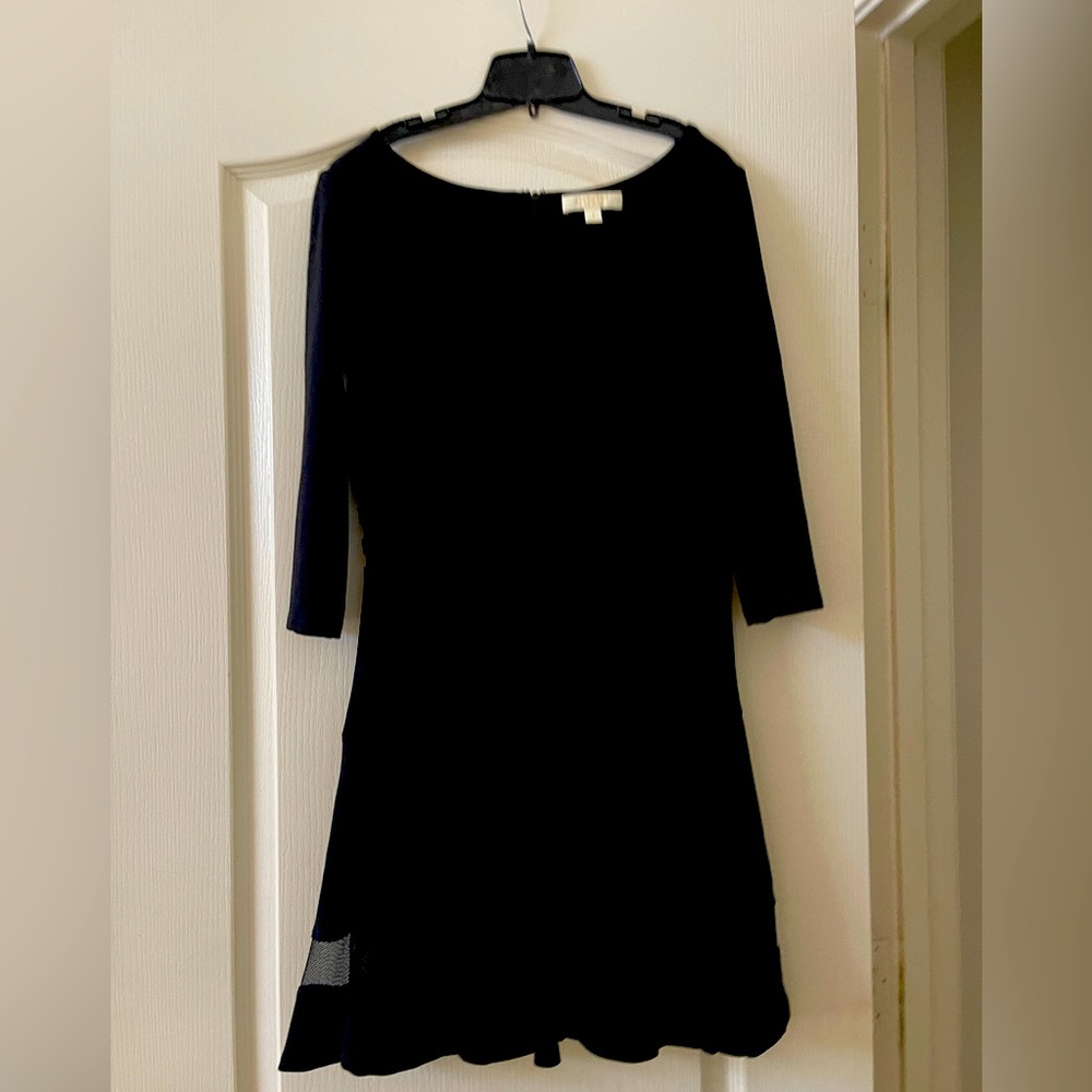 Beautiful flattering black dress. Excellent condition.